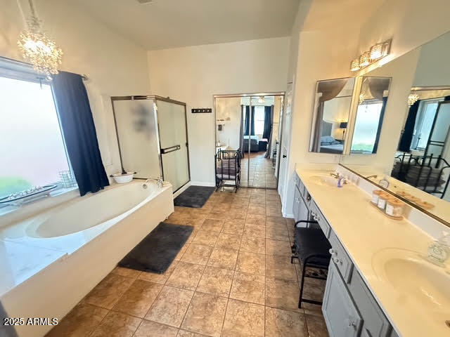 6743 East Tyndall Circle Mesa, AZ 85215 - Photo 16 of 27 a large bathroom with a tub sink and mirror