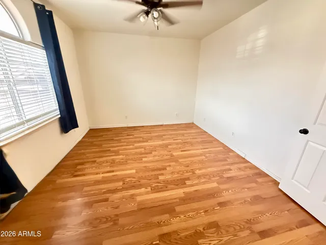 a view of a big room with windows