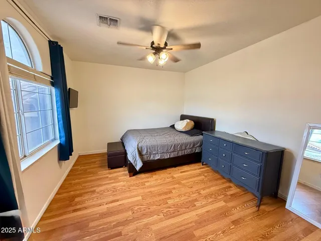 a bedroom with a bed and window