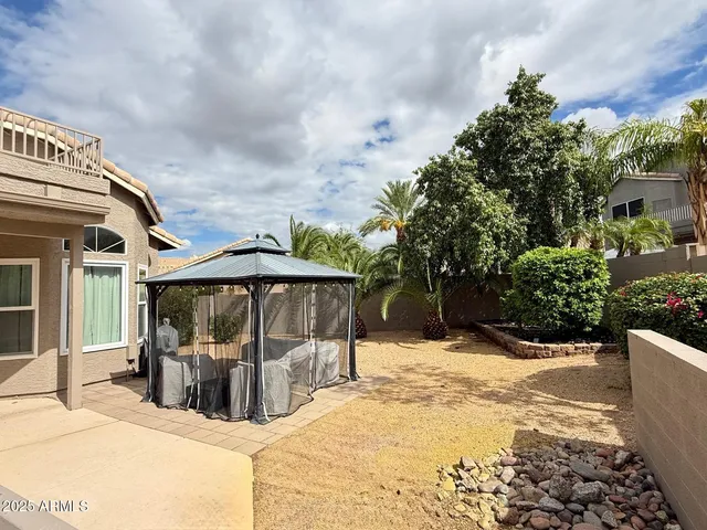 a view of a house with snow in the backyard