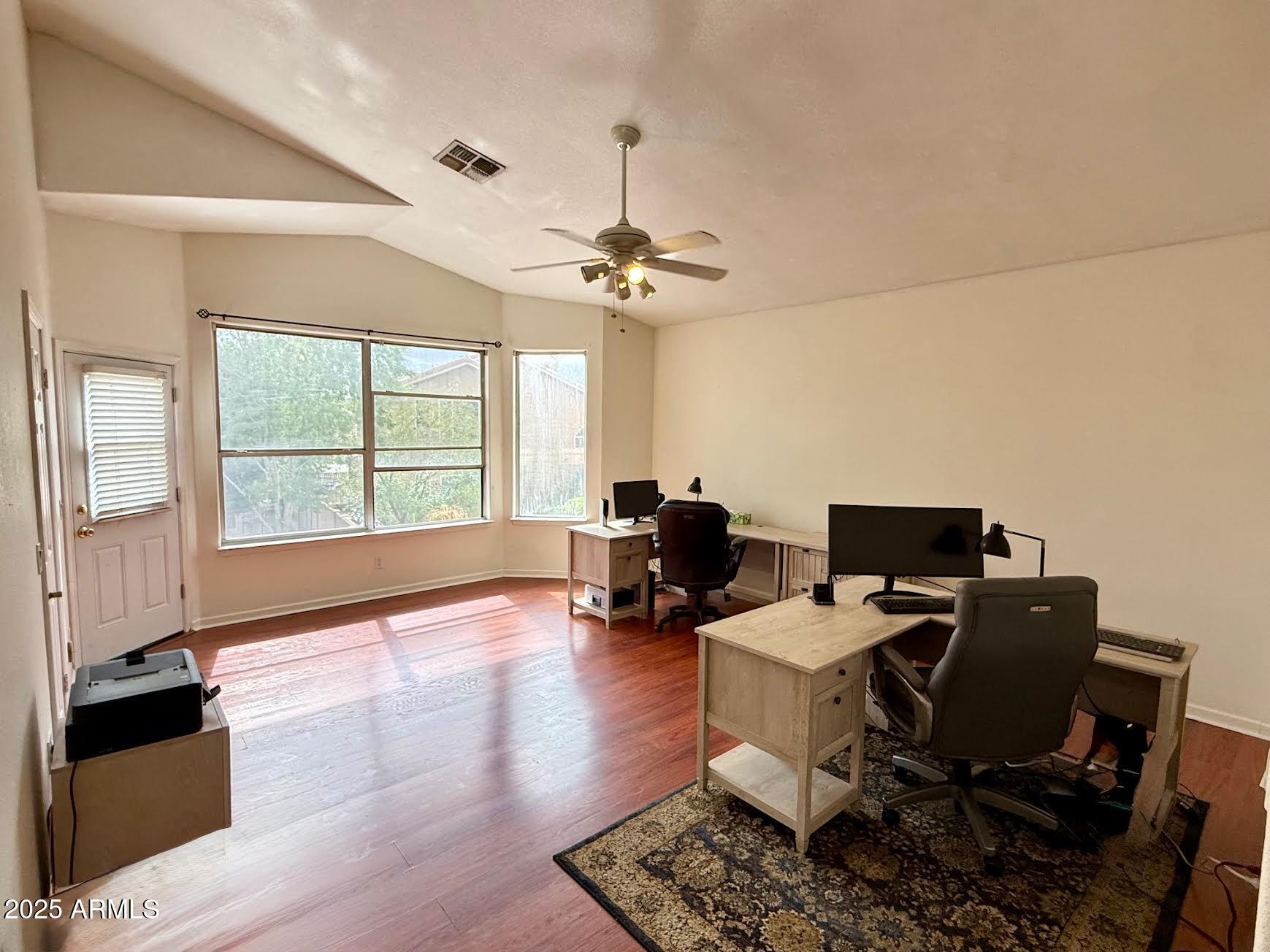 6743 East Tyndall Circle Mesa, AZ 85215 - Photo 23 of 27 a view of a workspace with furniture and a window