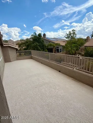a view of balcony with furniture