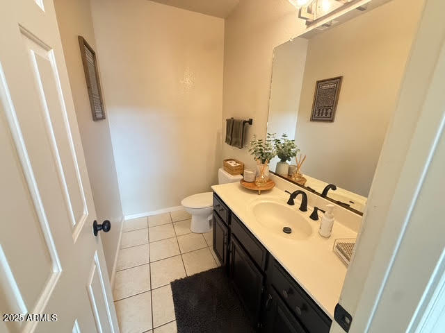 6743 East Tyndall Circle Mesa, AZ 85215 - Photo 26 of 27 a bathroom with a sink a toilet and a mirror