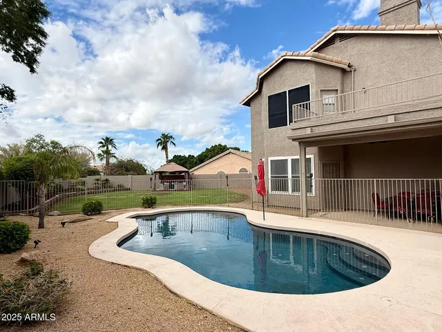 a view of a house with a sink and a yard
