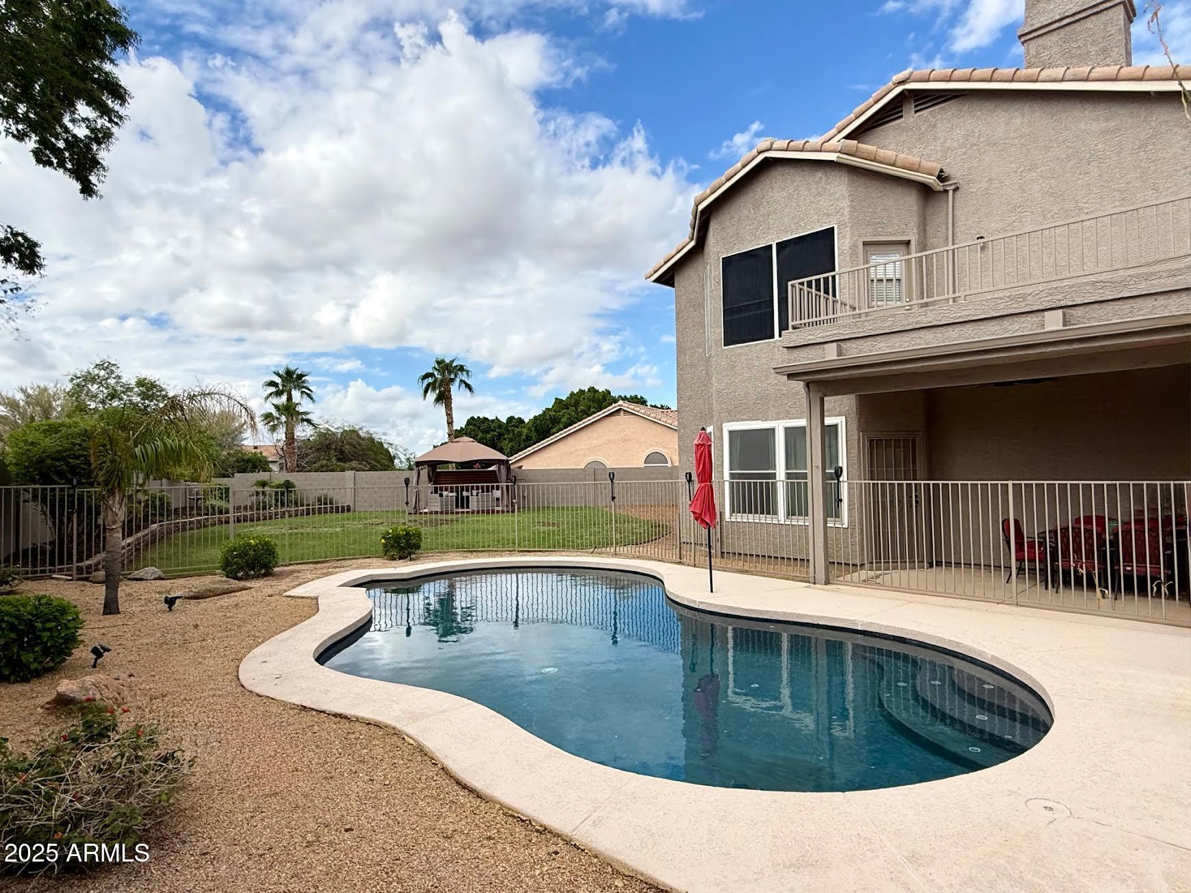 6743 East Tyndall Circle Mesa, AZ 85215 - Photo 5 of 27 a view of a house with a sink and a yard