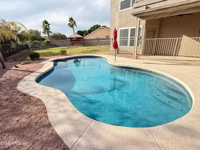 a view of outdoor space and swimming pool