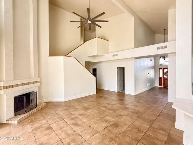 a view interior of a house with entryway and fireplace