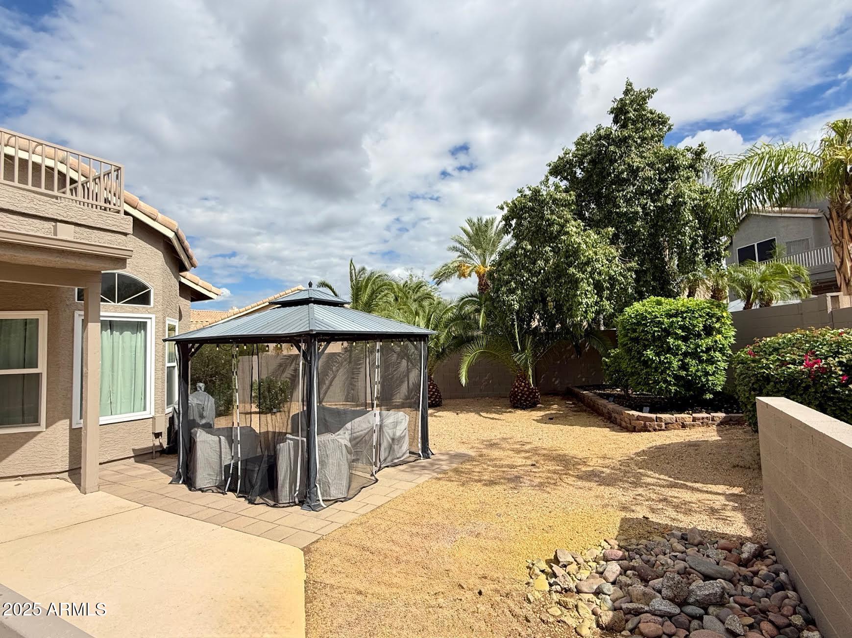 6743 East Tyndall Circle Mesa, AZ 85215 - Photo 10 of 27 a view of a house with snow in the backyard
