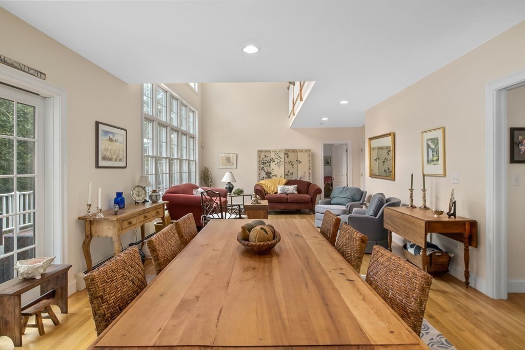 29 Spruce Road Harwich, MA 02645 - Photo 11 of 41 a living room with furniture a large window and wooden floor