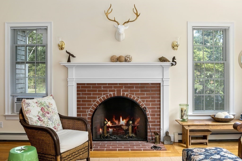 29 Spruce Road Harwich, MA 02645 - Photo 13 of 41 a living room with furniture a window and a fireplace