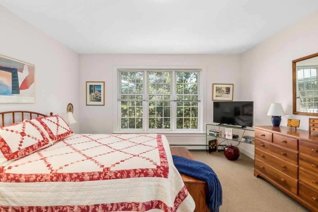 29 Spruce Road Harwich, MA 02645 - Photo 18 of 41 a bedroom with a bed and furniture