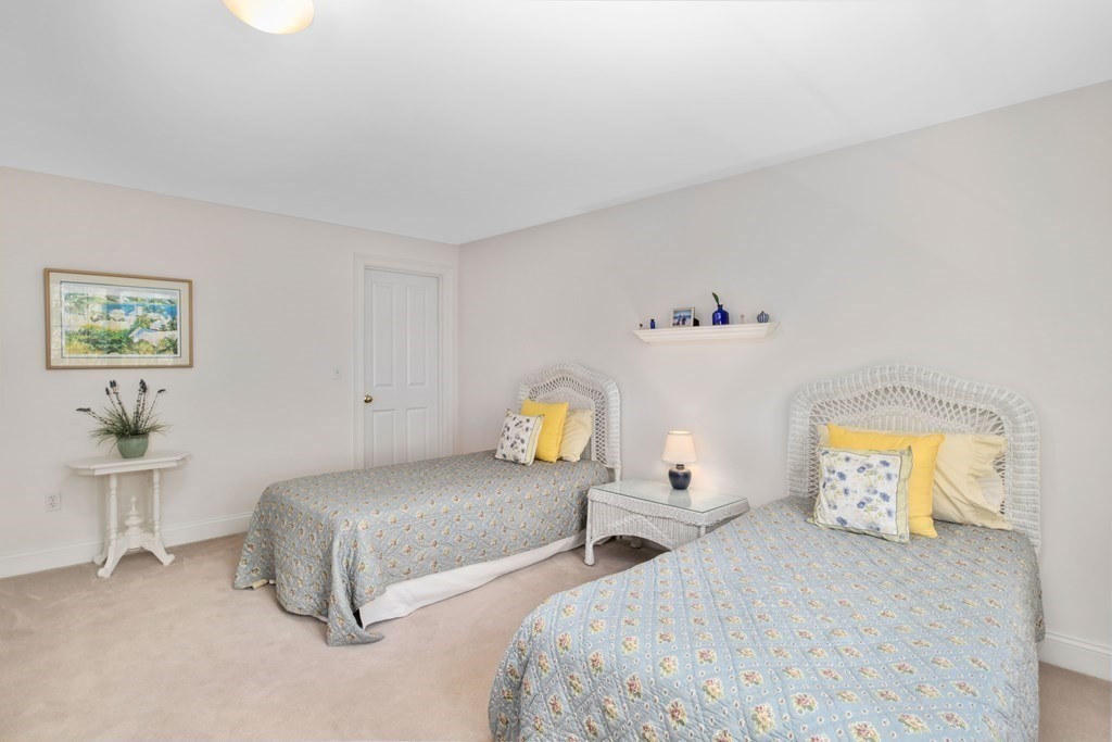 29 Spruce Road Harwich, MA 02645 - Photo 24 of 41 a bedroom with two beds and painting on the wall