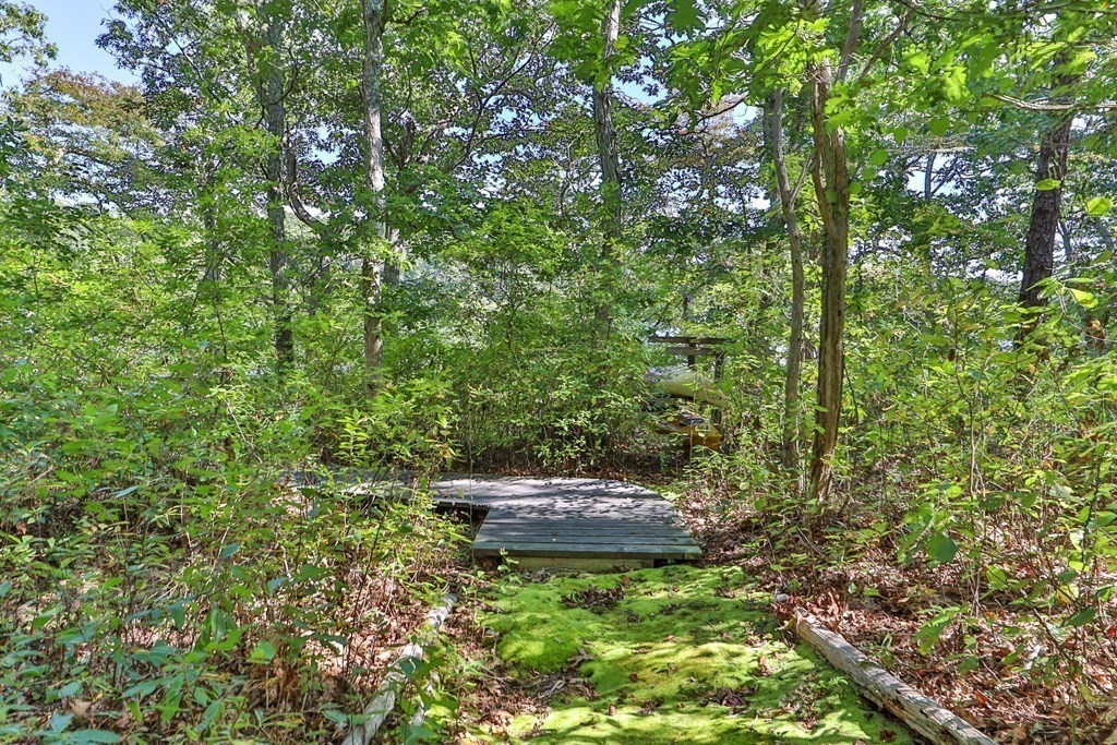 29 Spruce Road Harwich, MA 02645 - Photo 26 of 41 a backyard of a house with a yard and outdoor seating