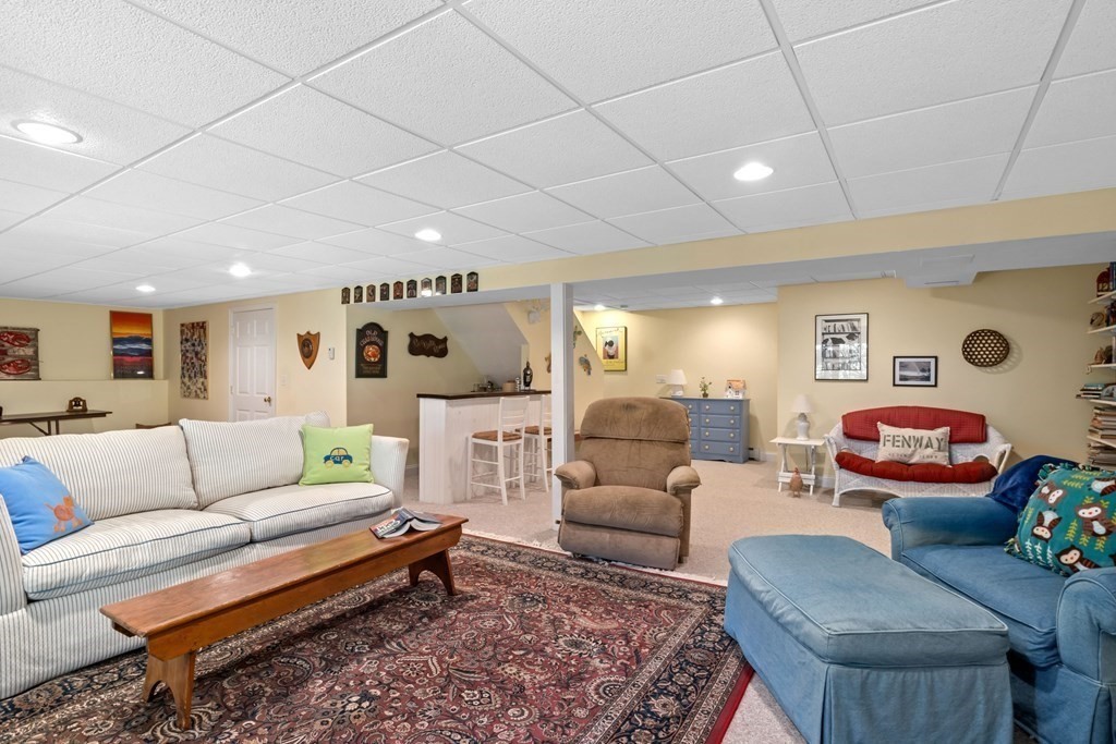 29 Spruce Road Harwich, MA 02645 - Photo 32 of 41 a living room with furniture and a rug