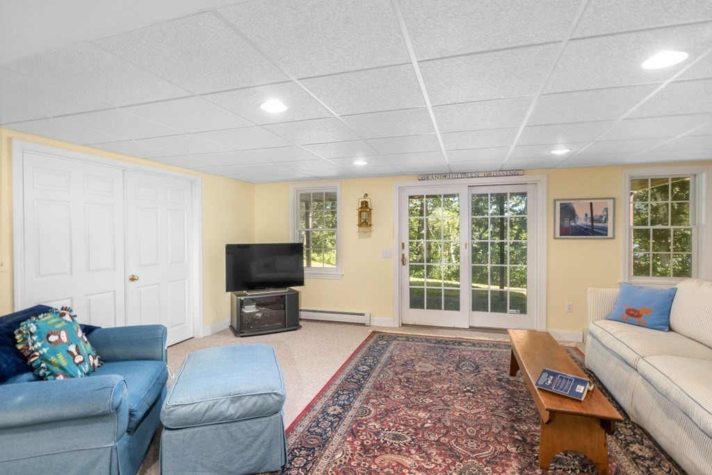 29 Spruce Road Harwich, MA 02645 - Photo 34 of 41 a living room with furniture and a flat screen tv