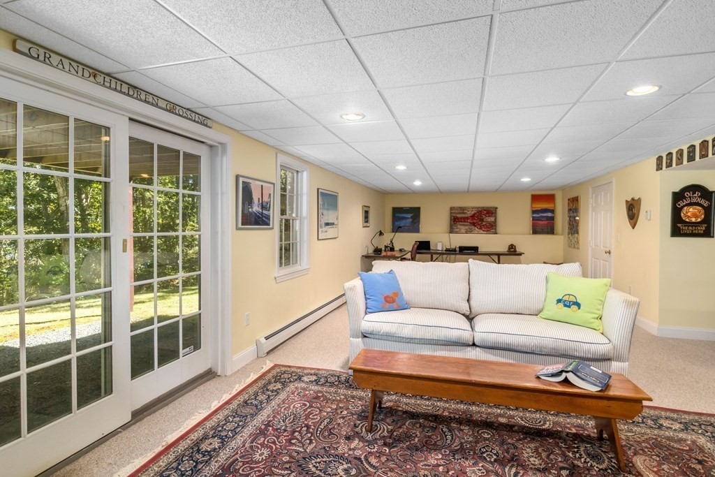 29 Spruce Road Harwich, MA 02645 - Photo 36 of 41 a living room with furniture and a window