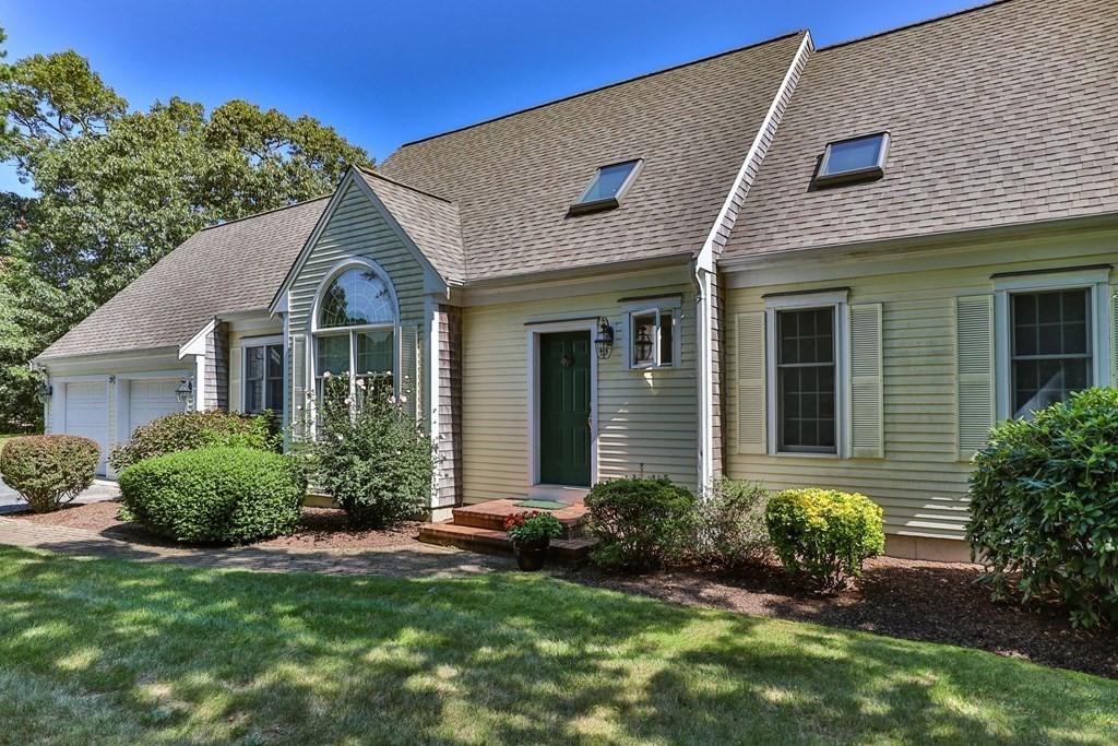 29 Spruce Road Harwich, MA 02645 - Photo 4 of 41 a front view of a house with a yard
