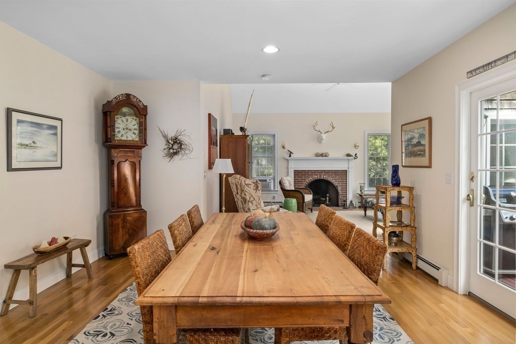 29 Spruce Road Harwich, MA 02645 - Photo 9 of 41 a living room with furniture a fireplace and flat screen tv