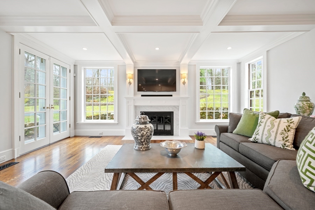 17 Ravine Road Wellesley, MA 02481 - Photo 20 of 42 a living room with furniture a flat screen tv and a fireplace