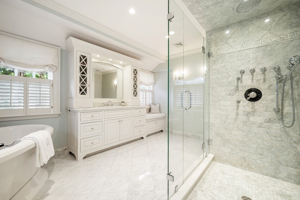 17 Ravine Road Wellesley, MA 02481 - Photo 24 of 42 a bathroom with a double vanity sink toilet mirror and bathtub
