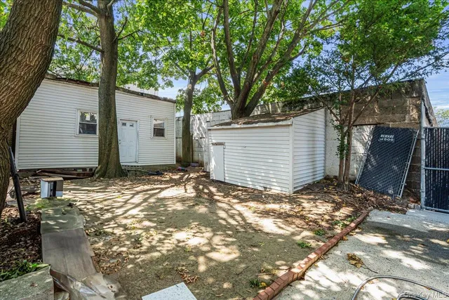 a view of house with backyard
