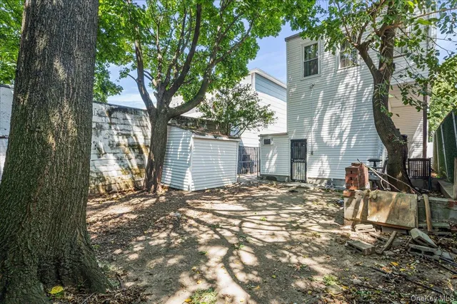 a view of a house with a tree