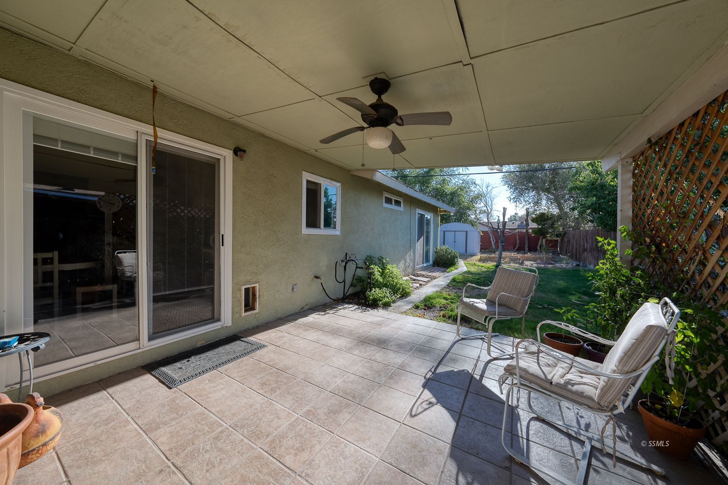 617 South Downs Street Ridgecrest, CA 93555 - Photo 22 of 34 a view of a patio with table and chairs potted plants with wooden floor