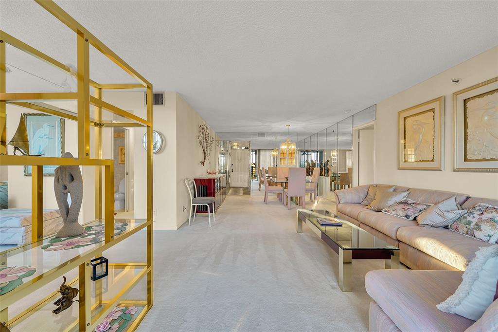 5340 Northwest 2nd Avenue, Unit PH26 Boca Raton, FL 33487 - Photo 11 of 53 a living room with furniture and a window