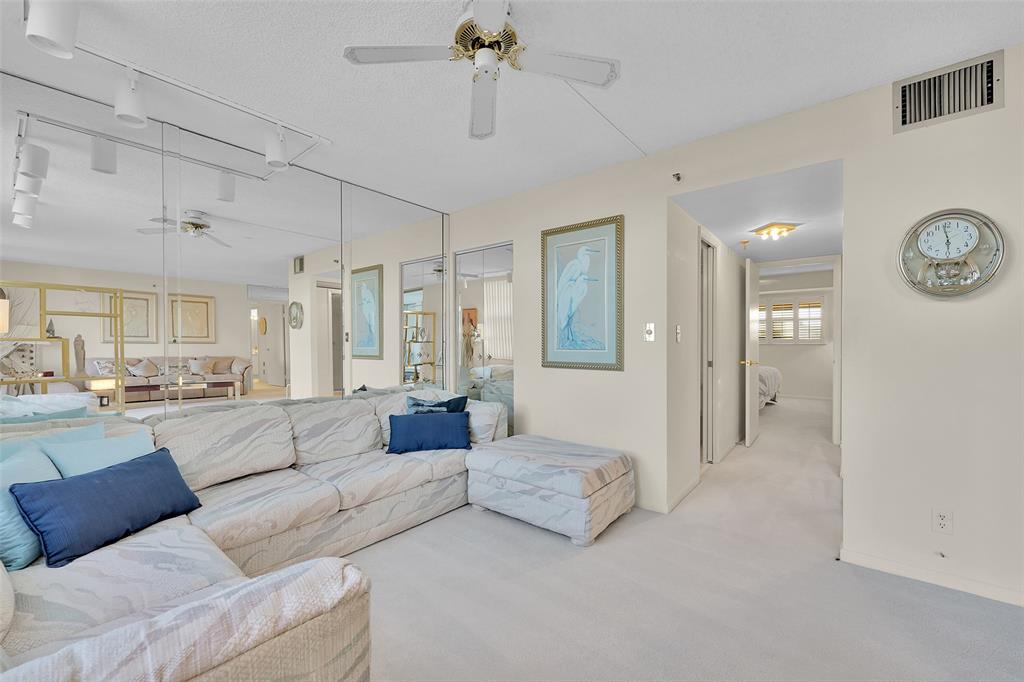 5340 Northwest 2nd Avenue, Unit PH26 Boca Raton, FL 33487 - Photo 12 of 53 a living room with furniture and a large window