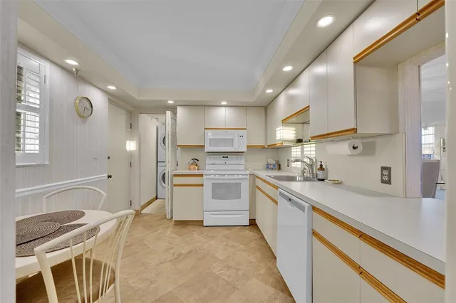 a kitchen with a sink stainless steel appliances and cabinets