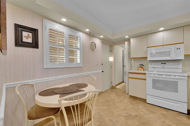 a kitchen with sink cabinets and stove