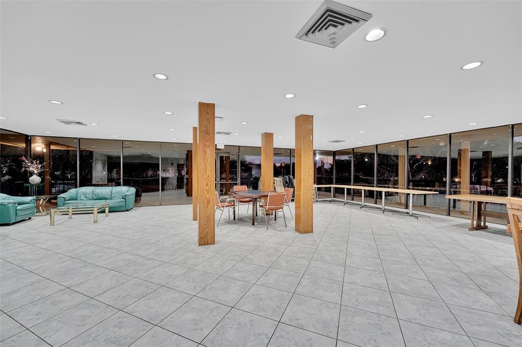 5340 Northwest 2nd Avenue, Unit PH26 Boca Raton, FL 33487 - Photo 31 of 53 a view of a lobby with black carpet