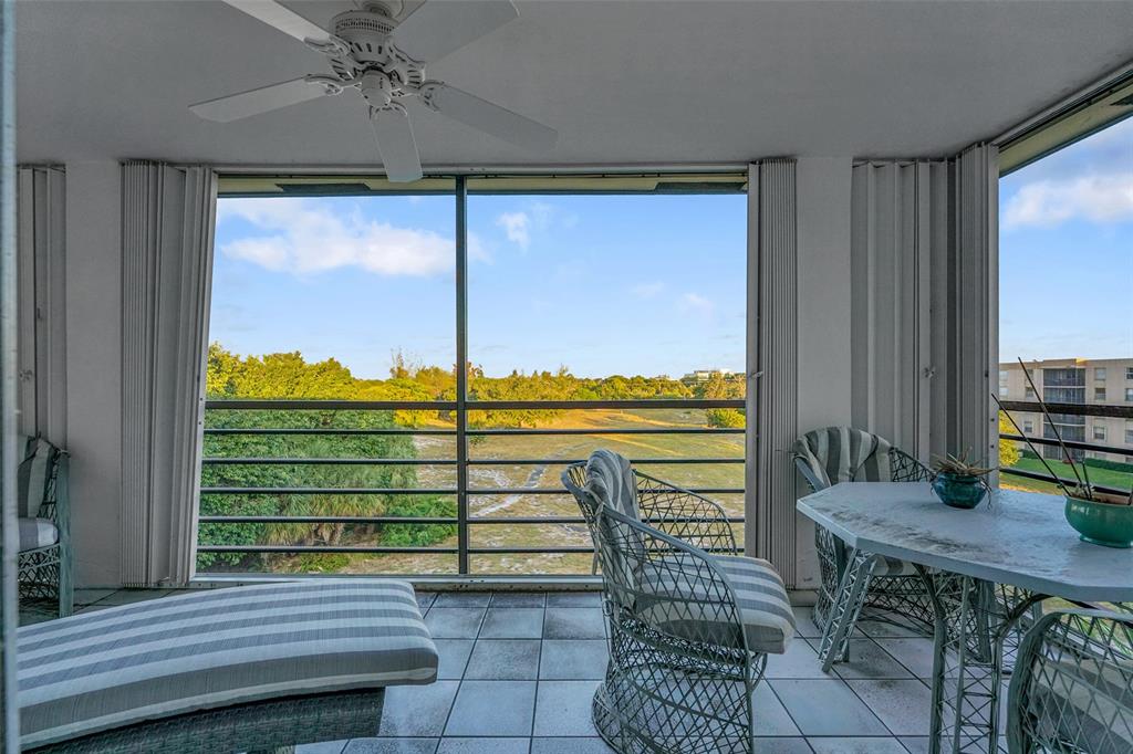 5340 Northwest 2nd Avenue, Unit PH26 Boca Raton, FL 33487 - Photo 32 of 53 a view of a dining room with furniture window and outside view