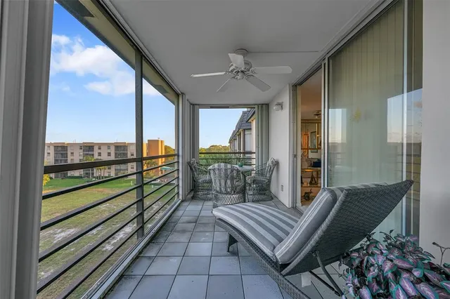 a view of a two chairs in the balcony