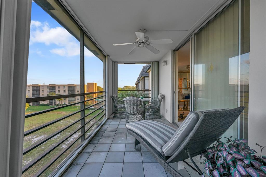 5340 Northwest 2nd Avenue, Unit PH26 Boca Raton, FL 33487 - Photo 35 of 53 a view of a two chairs in the balcony