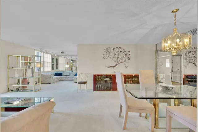 a view of a living room and kitchen