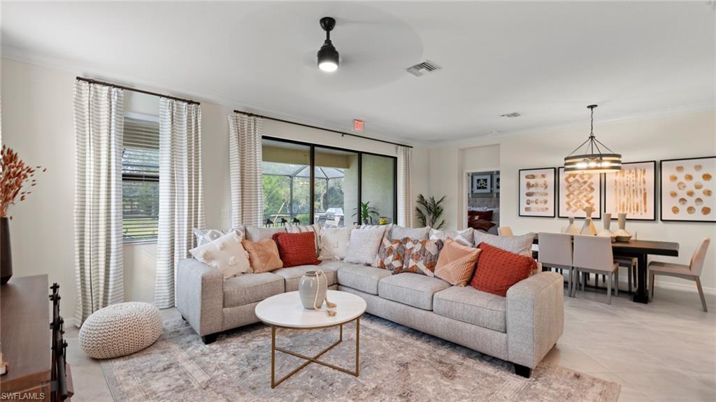 20641 Copperhead Drive Lehigh Acres, FL 33936 - Photo 12 of 27 a living room with furniture and a large window