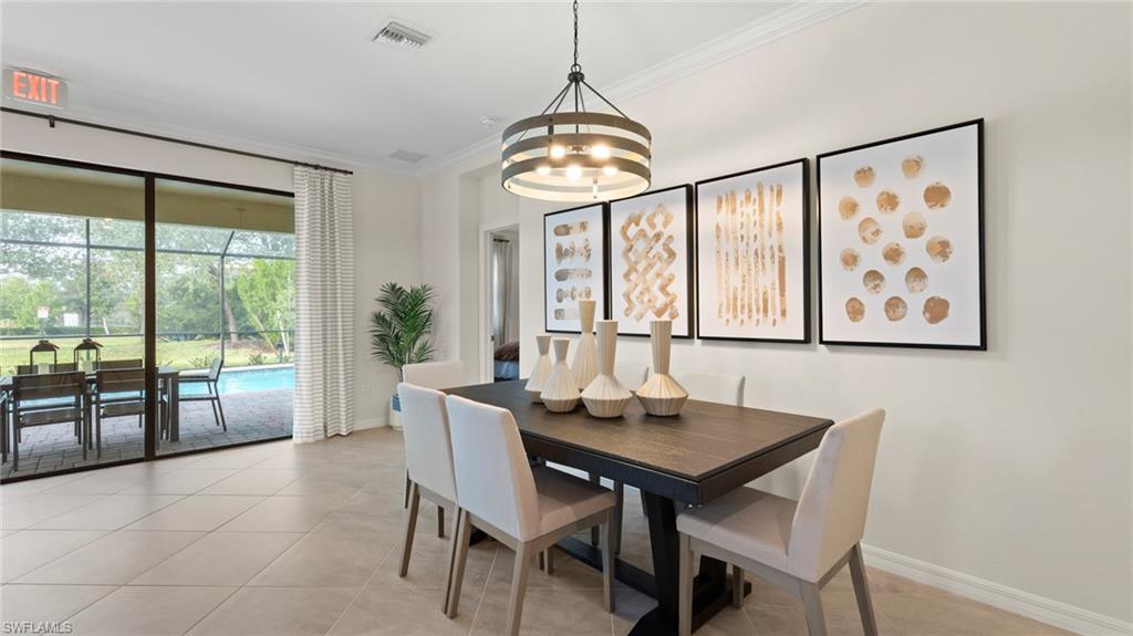20641 Copperhead Drive Lehigh Acres, FL 33936 - Photo 7 of 27 a dining room with furniture window and wooden floor