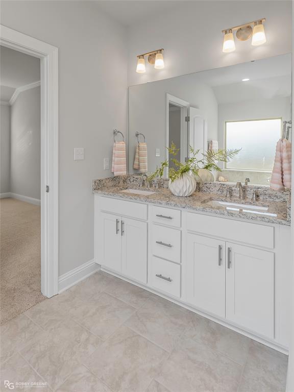 727 Bianca Street Haughton, LA 71037 - Photo 11 of 22 a spacious bathroom with a granite countertop sink and a mirror