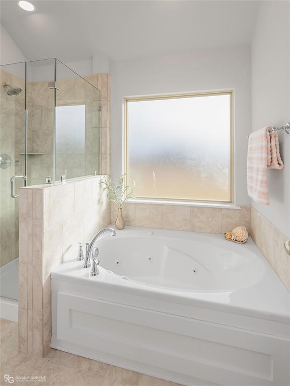 727 Bianca Street Haughton, LA 71037 - Photo 12 of 22 a bathroom with a bathtub and a shower