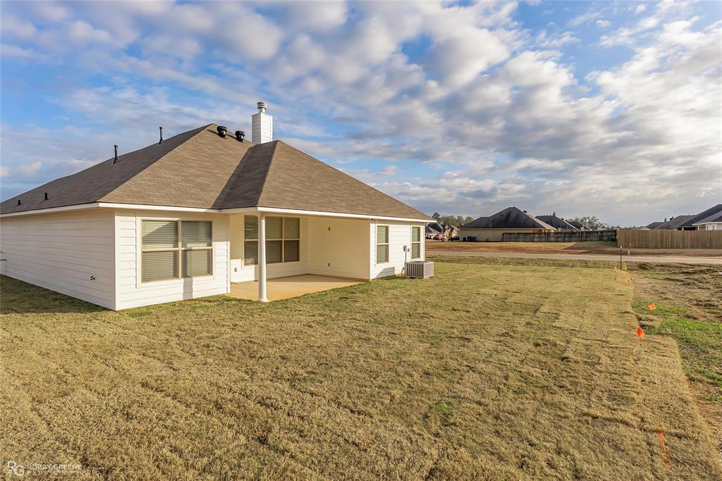 727 Bianca Street Haughton, LA 71037 - Photo 20 of 22 a view of a house with a yard