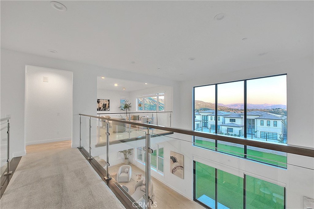 20164 Galway Lane Porter Ranch, CA 91326 - Photo 28 of 48 Open upper-level catwalk overlooking the dramatic double-height living spaces