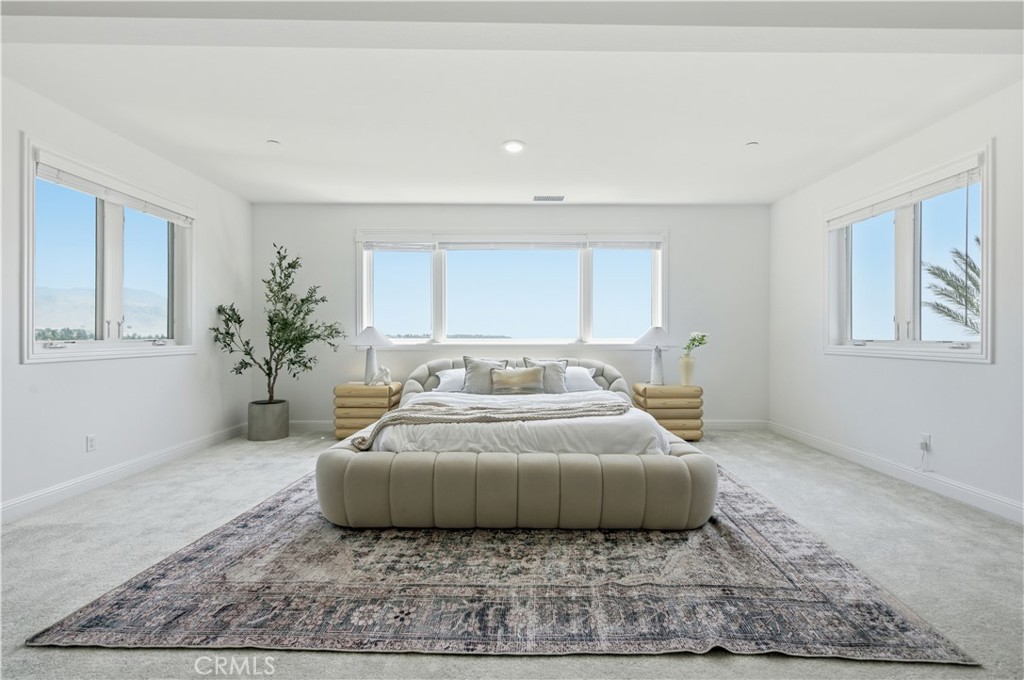 20164 Galway Lane Porter Ranch, CA 91326 - Photo 30 of 48 Light-filled primary bedroom with generous scale and seating lounge