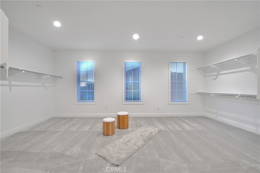 20164 Galway Lane Porter Ranch, CA 91326 - Photo 32 of 48 Expansive walk-in primary dressing room with exceptional storage and scale