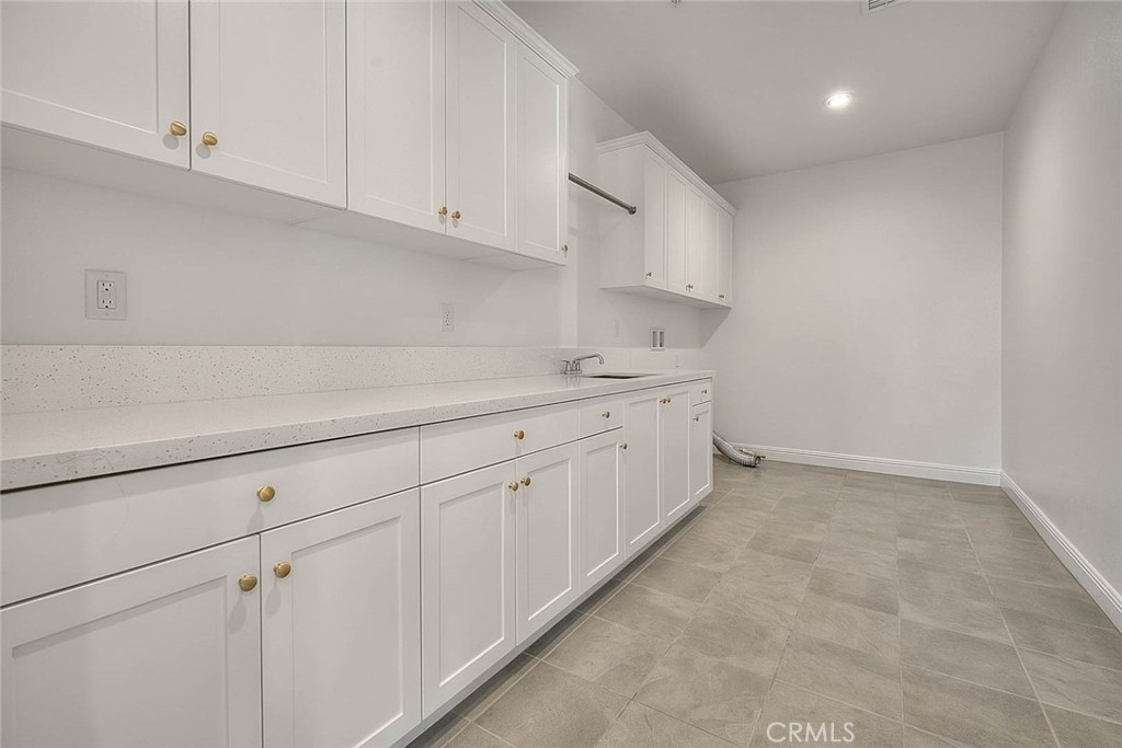 20164 Galway Lane Porter Ranch, CA 91326 - Photo 35 of 48 Oversized laundry room with storage