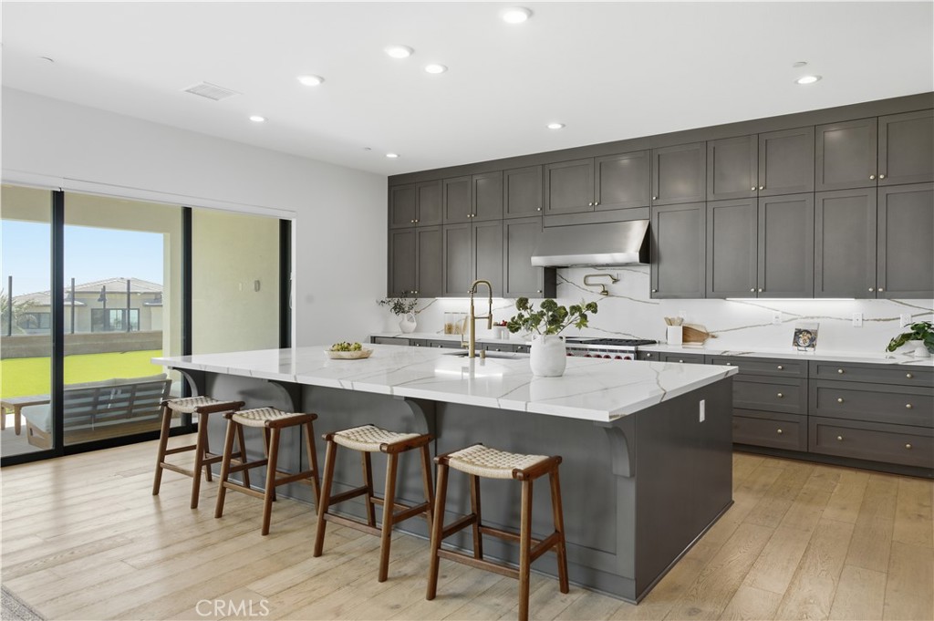 20164 Galway Lane Porter Ranch, CA 91326 - Photo 8 of 48 Designer kitchen anchored by an oversized island