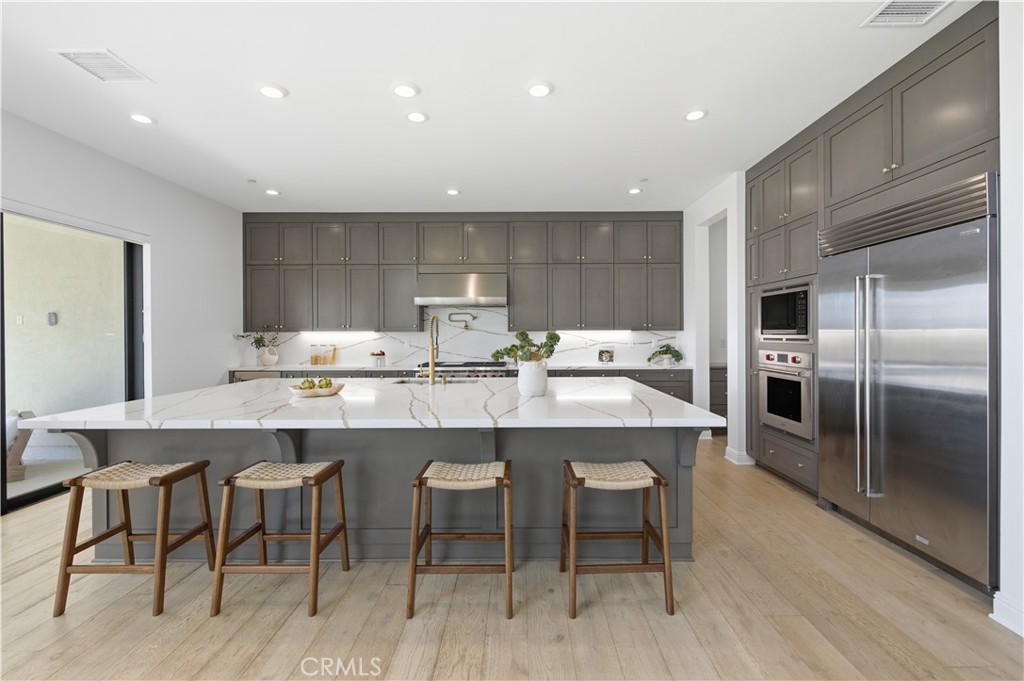 20164 Galway Lane Porter Ranch, CA 91326 - Photo 10 of 48 Professional-grade kitchen with curated high-end finishes