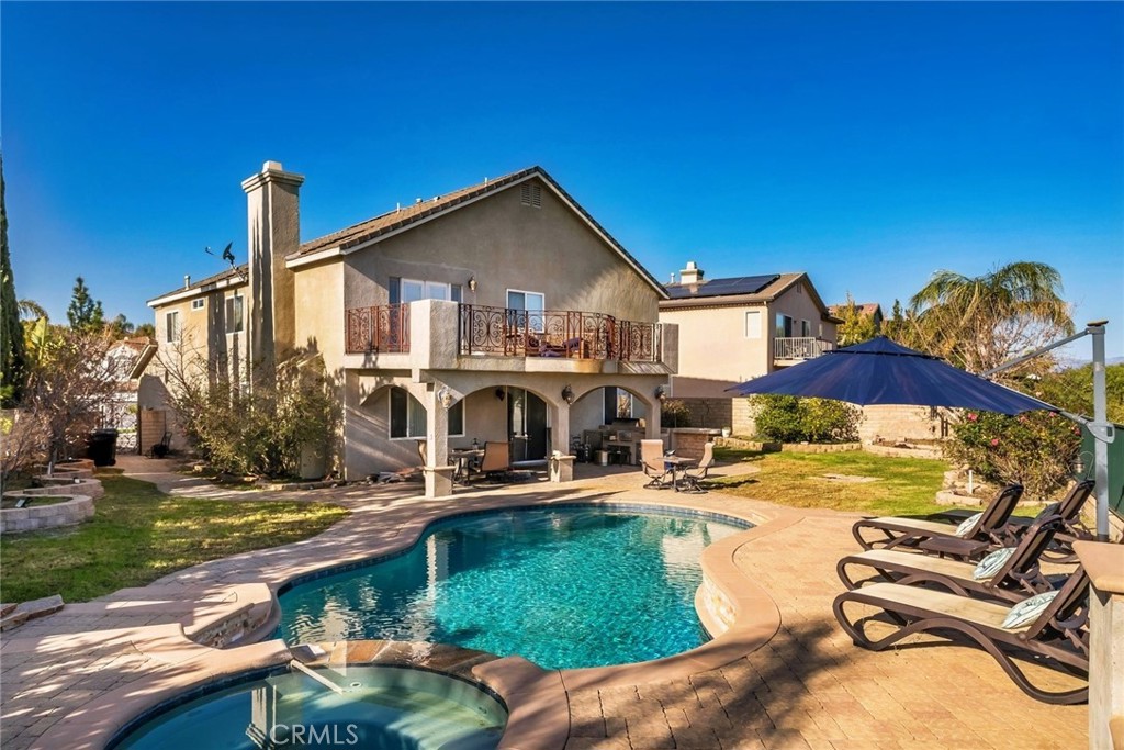 26403 Ocasey Place Stevenson Ranch, CA 91381 - Photo 12 of 27 a view of a house with swimming pool and sitting area