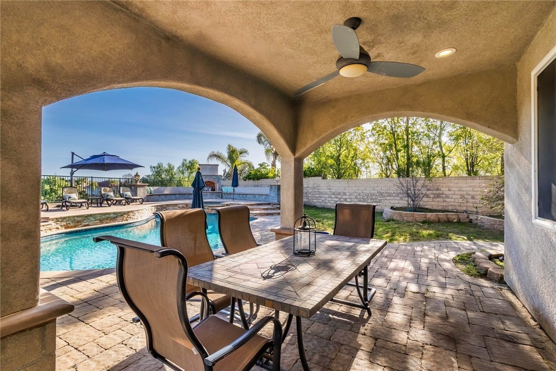 26403 Ocasey Place Stevenson Ranch, CA 91381 - Photo 15 of 27 a view of an outdoor dining space with a table and chairs