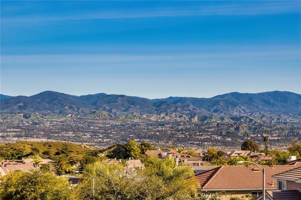 26403 Ocasey Place Stevenson Ranch, CA 91381 - Photo 19 of 27 a view of a city with mountains in the background